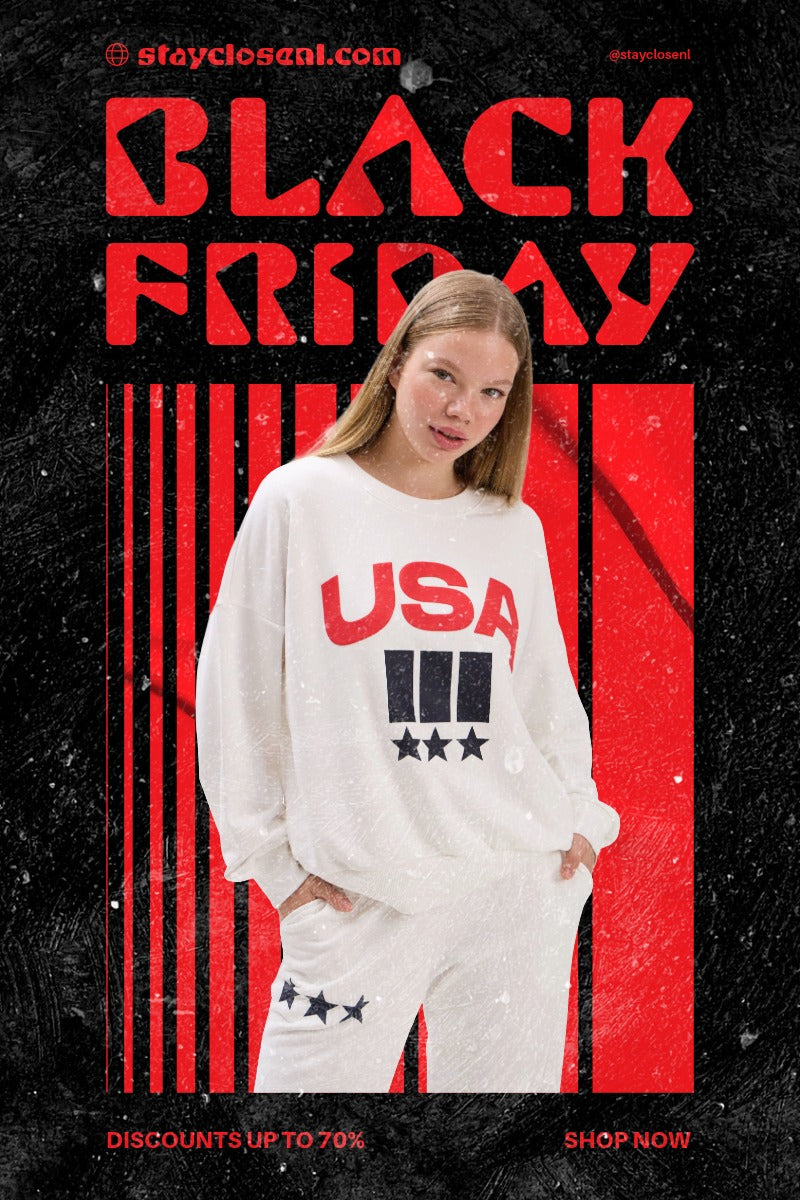 Person wearing a white sweater with 'USA' print on a black background with red text.