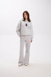Grey USA hoodie and sweatpants set with elastic waist, side pockets, and multicolor embroidery.