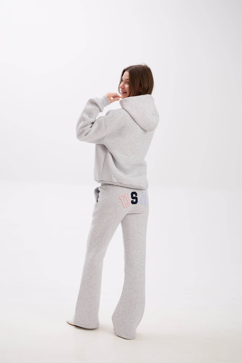 Grey sweatpants featuring elastic waistband, side pockets, and USA lettering on the back.