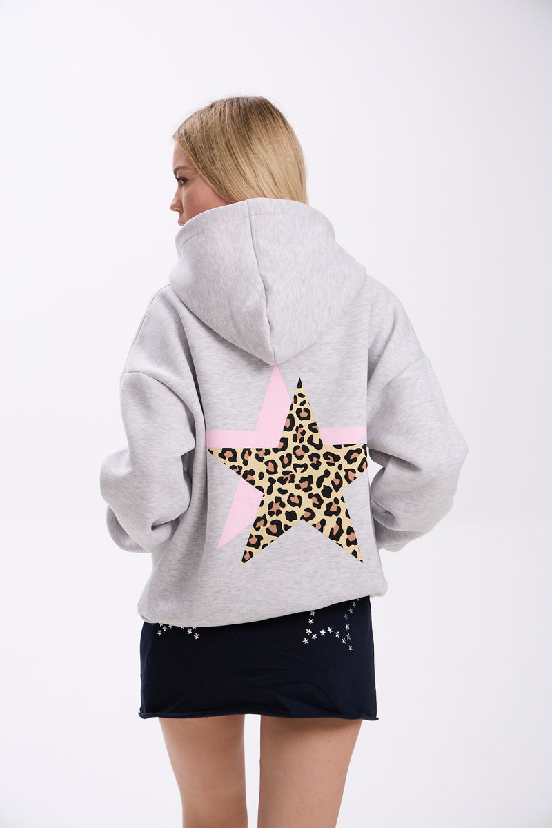 Person wearing a gray hoodie with a star design on the back, featuring leopard print and pink accents, on a white background.