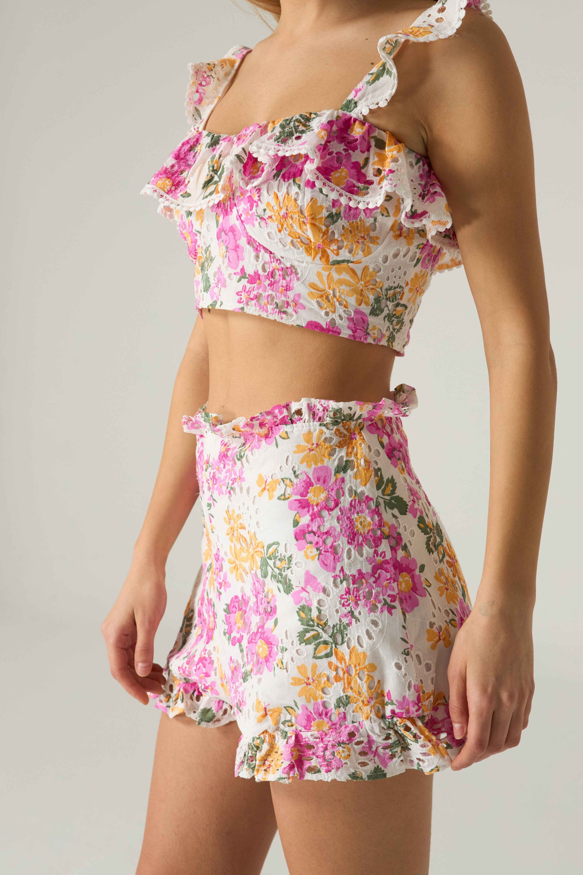 Floral two-piece outfit on a neutral background.