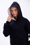 Person wearing a black hoodie with a white interior lining on a white background.