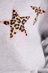 Gray sweatshirt with leopard print star and pink text on a plain background