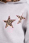 Close-up of a light grey hoodie featuring two leopard print star patches outlined in pink stitching with the words “Stay Close” embroidered in pink thread beneath the design.