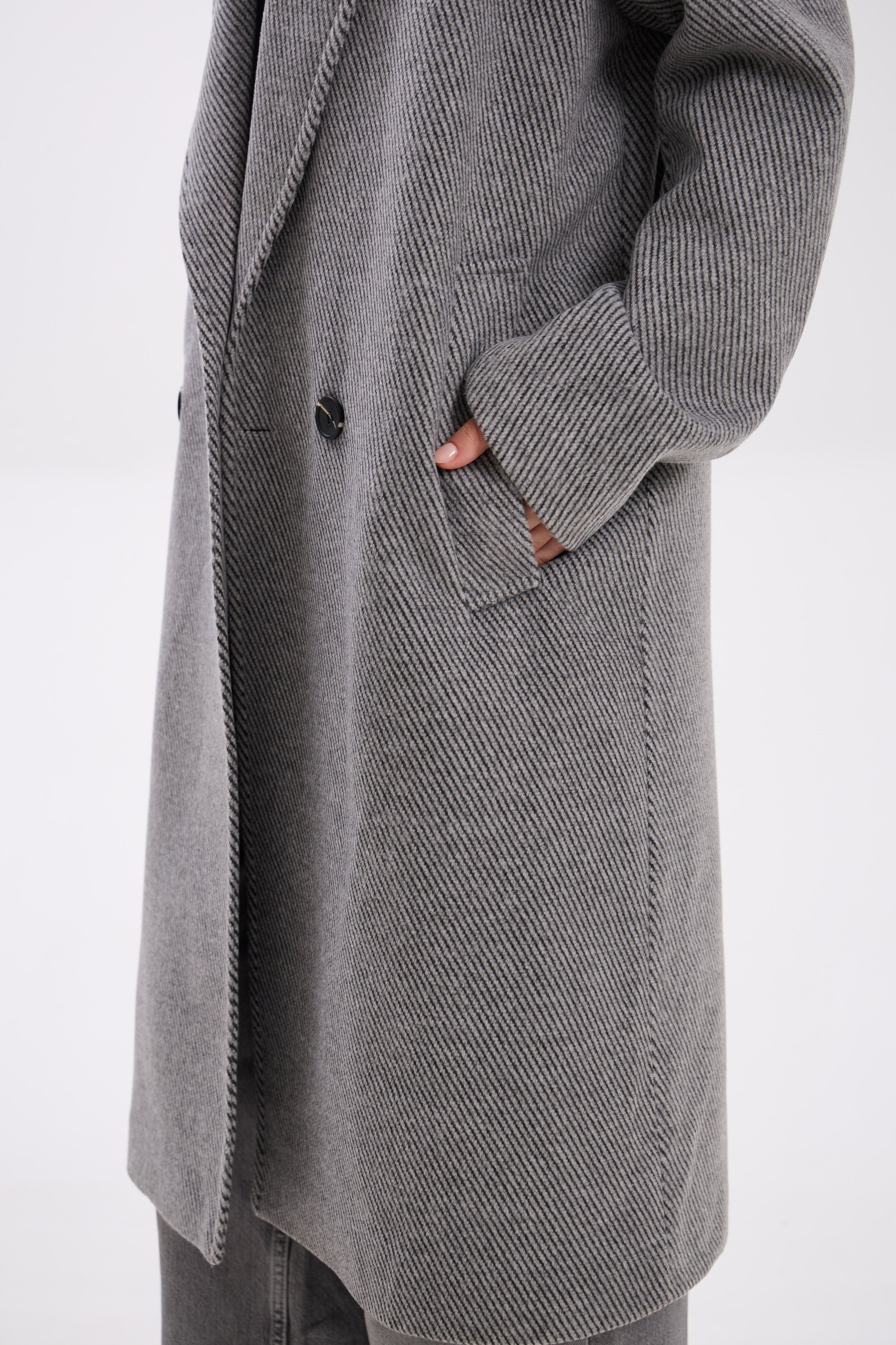 Gray coat with a button on a white background