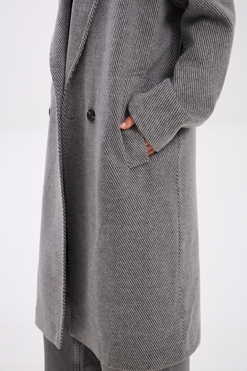 Gray coat with a button on a white background
