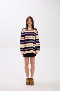 Person wearing a striped sweater on a white background