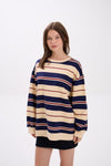 Woman wearing a striped sweater on a white background