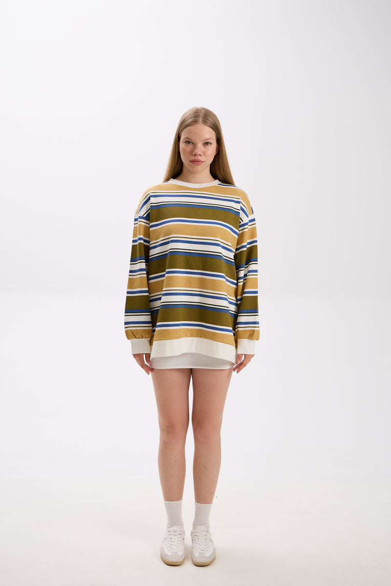 Person wearing a striped sweater on a white background