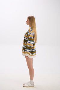 Person wearing a striped sweater on a white background