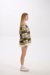 Person wearing a striped sweater on a white background