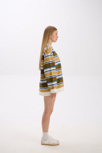 Person wearing a striped sweater on a white background