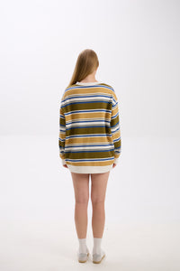Person wearing a striped sweater on a white background
