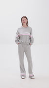 Grey sweat set with pink stripe details, elastic waistband and side pockets for a comfy casual look.