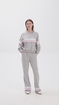 Grey sweat set with pink stripe details, elastic waistband and side pockets for a comfy casual look.